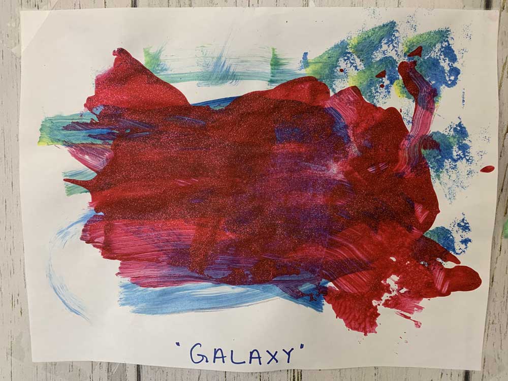 A red painting of the us map with the word " galaxy " written underneath it.